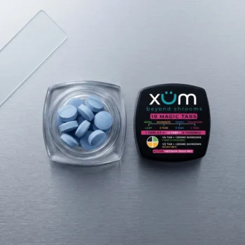 Top-down view of an open XUM Beyond Shrooms jar on a sleek metallic surface