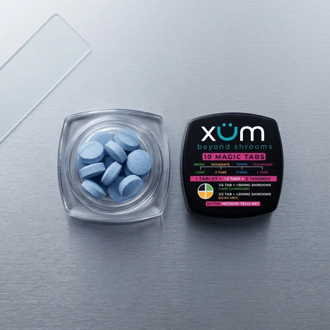 Top-down view of an open XUM Beyond Shrooms jar on a sleek metallic surface